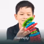 A kid with autism playing with colorful toys