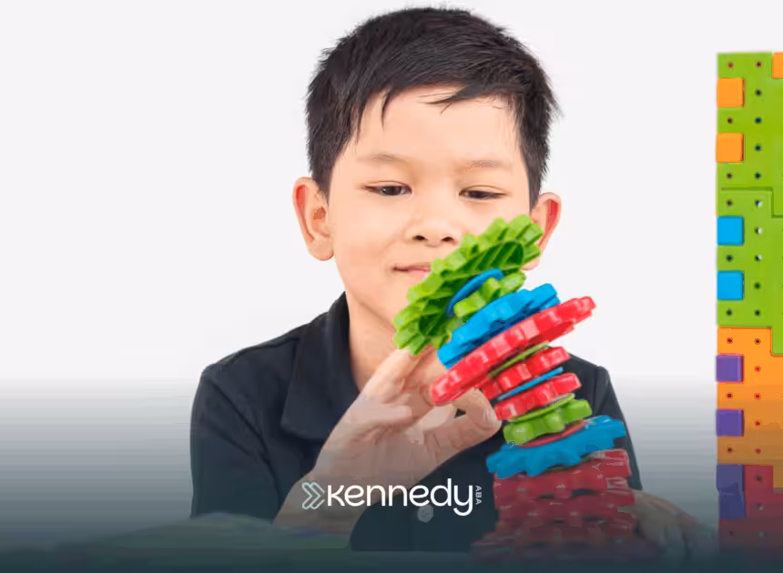 A kid with autism playing with colorful toys