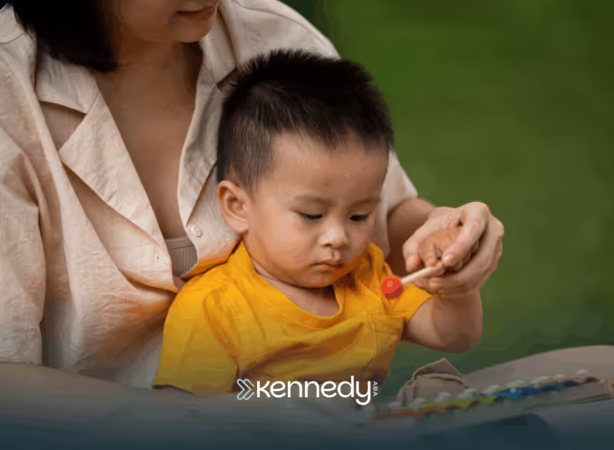 A kid with autism being held by his mother