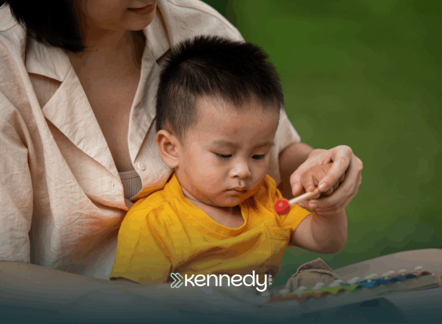 A kid with autism being held by his mother