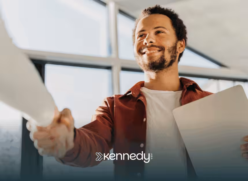 An autistic adult shaking the hands of his employer