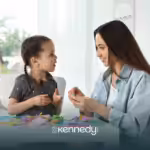 A child and an RBT during ABA therapy