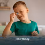 A kid with autism playing with puzzles on a table