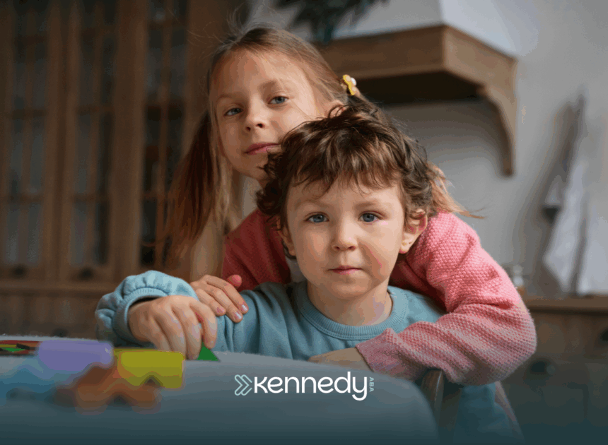 Two siblings, a girl and a boy, hugging together