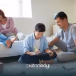 A family of four bonding together in their living room
