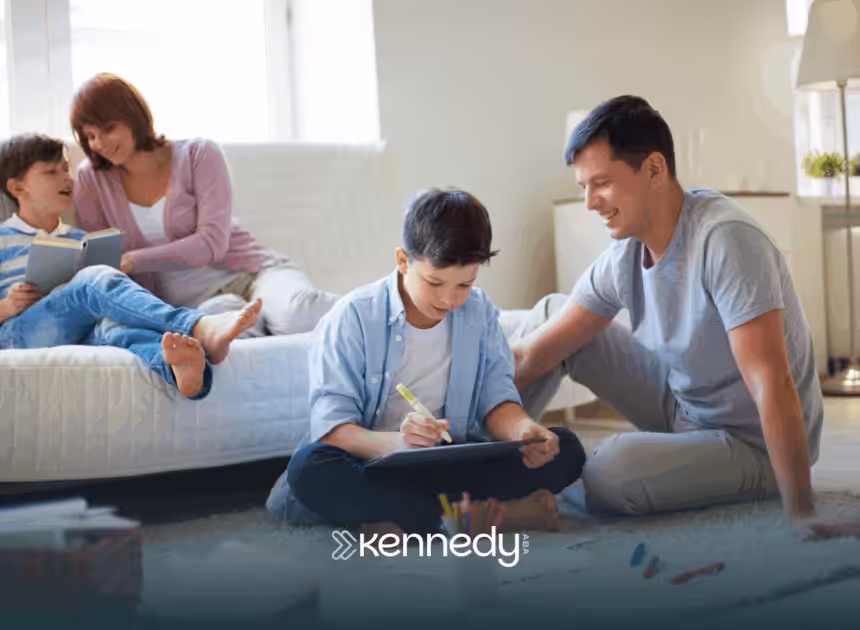 A family of four bonding together in their living room