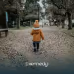 A kid walking alone outdoors