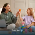 A 7-year-old and an RBT sitting on a couch during ABA therapy