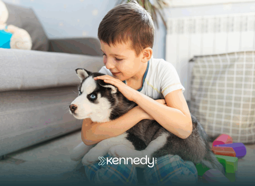 A kid with autism is holding his pet dog