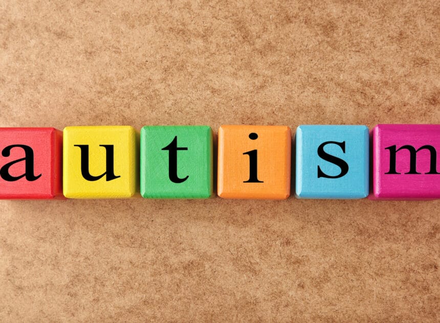 Colorful cubes that spell the word "autism"