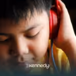 A kid listening to a headphone