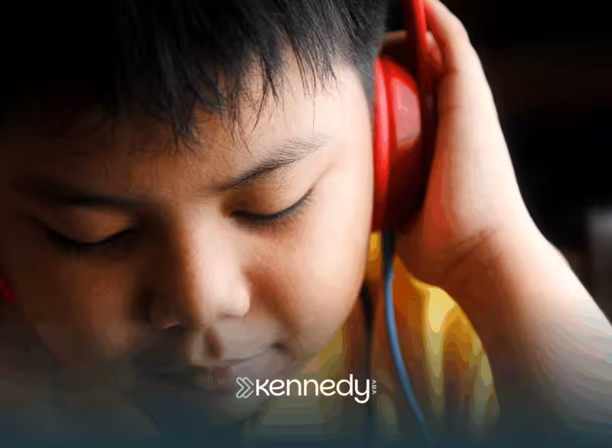 A kid listening to a headphone