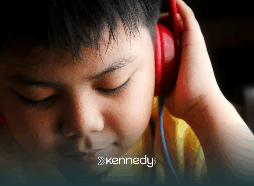 A kid listening to a headphone