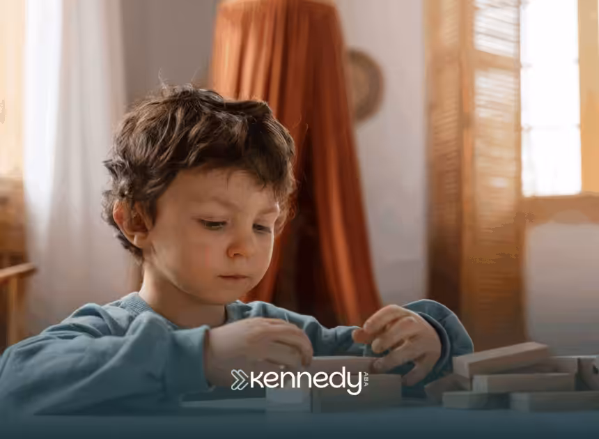 A kid with autism playing on a table