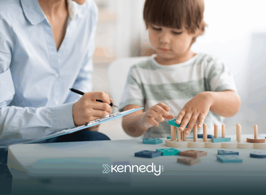 A kid with autism and his RBT during ABA therapy