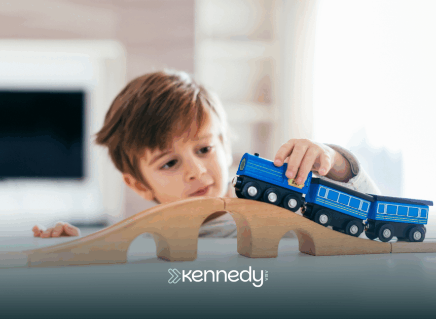 A kid with autism playing with a toy train
