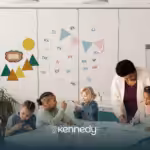 A teacher with her students during ABA therapy in the classroom