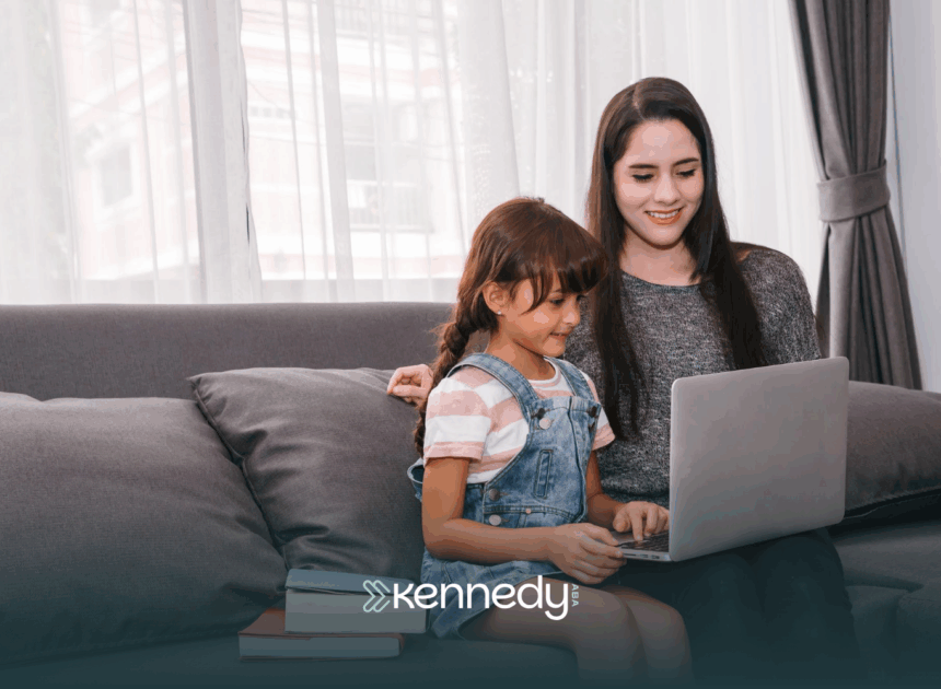 A kid with autism and his mom sitting on a couch, answering an online autism test