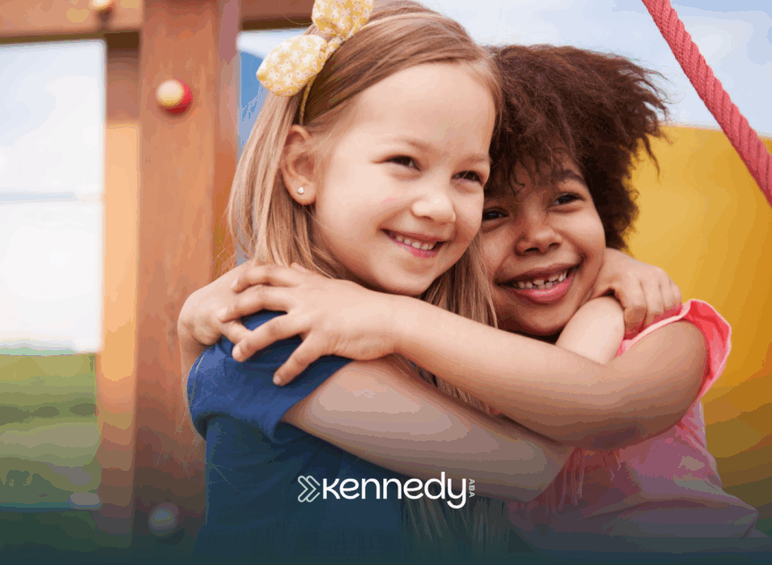 A girl with autism is hugging her friend in an outdoor playground