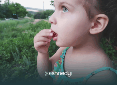 A child with autism biting on a grape