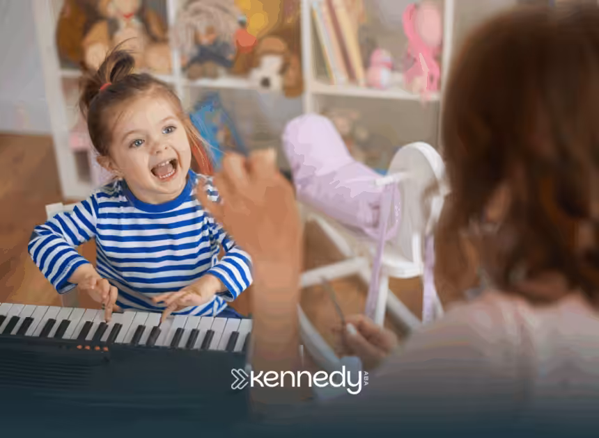 A kid with autism is playing a keyboard with her RBT during ABA therapy