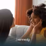 A mother is talking to her child with autism