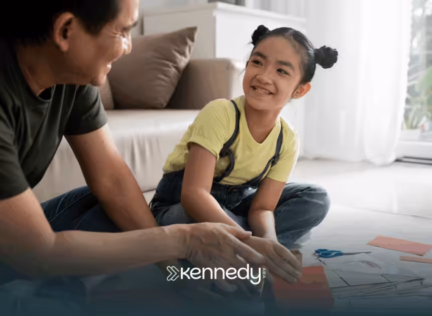 A kid with autism and her mother sitting on a living room carpet, happily talking got each other