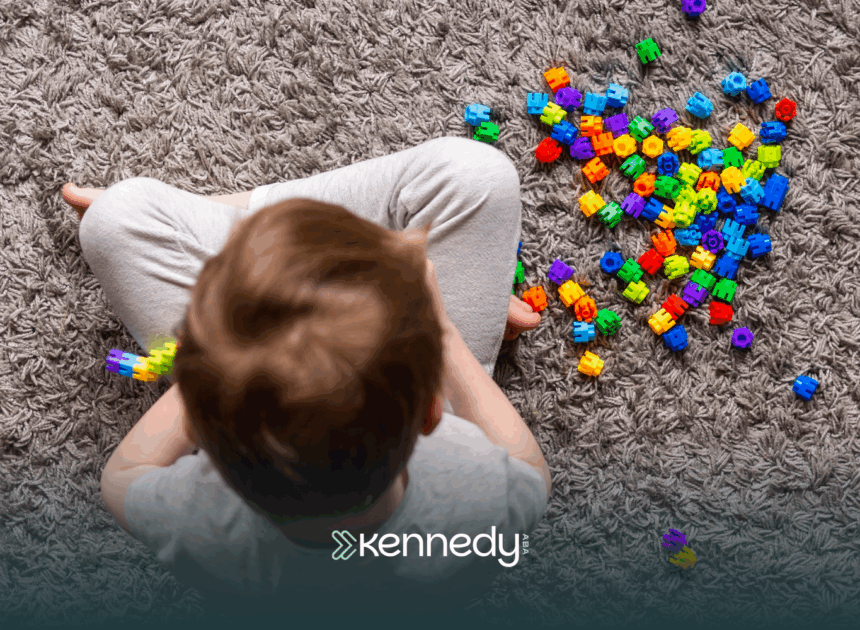 A kid sitting on a carpet, playing with colorful toys