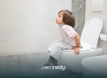 A kid with autism sitting on a toilet, potty training