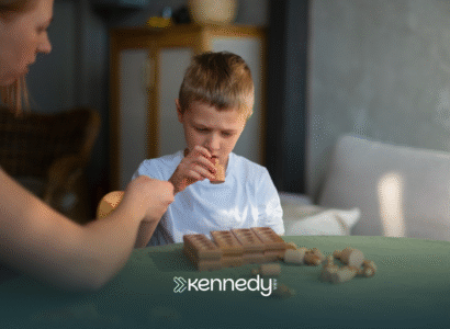 A kid with autism and an RBT during ABA therapy