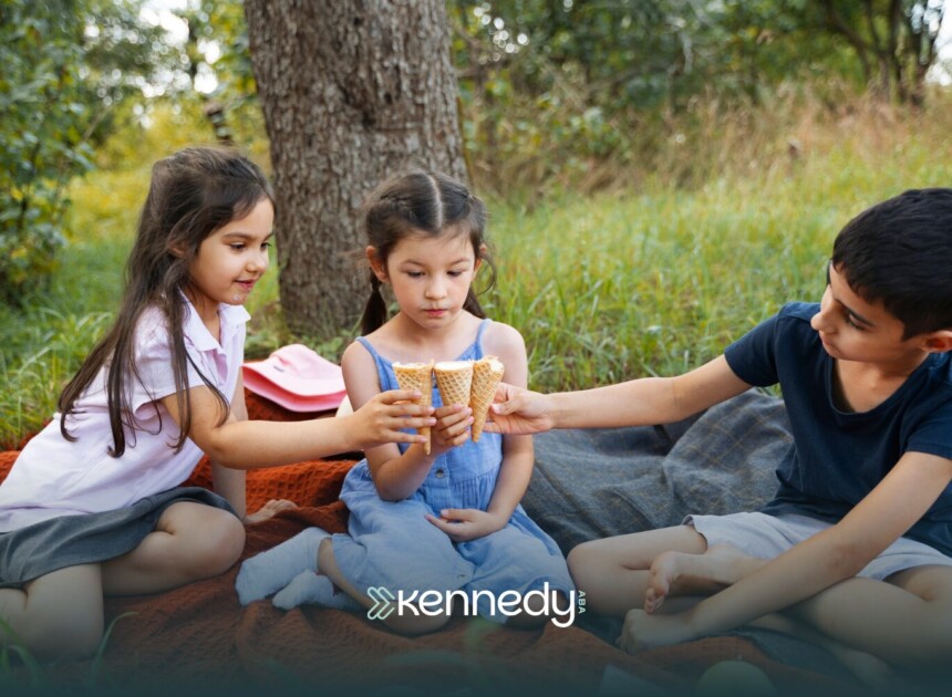 An autistic child sharing snacks with her friends in a picnic setting