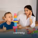 A kid with autism and an RBT during ABA therapy