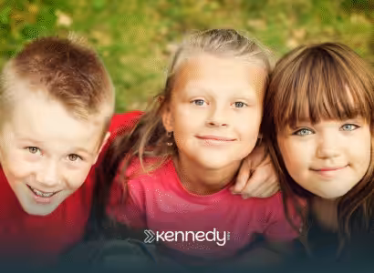 A group of kids smiling beside each other