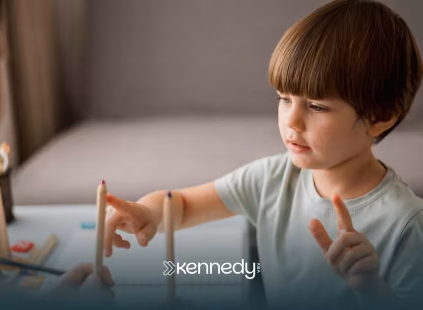 A kid with autism working on an activity during ABA therapy