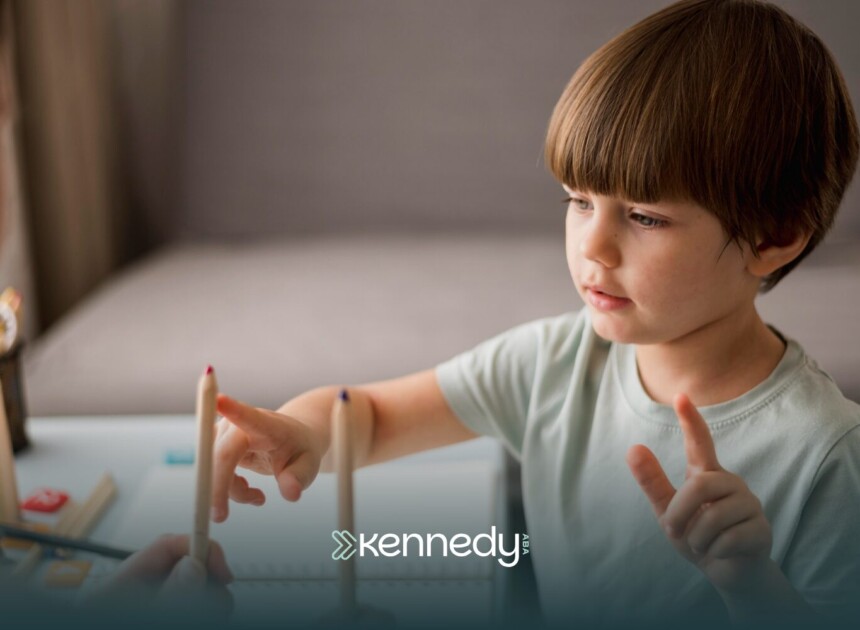 A kid with autism working on an activity during ABA therapy
