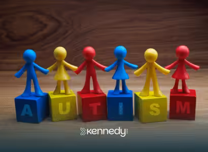 Primary-colored blocks spelling the word "autism"