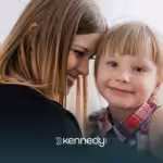 A mom and her daughter smiling together