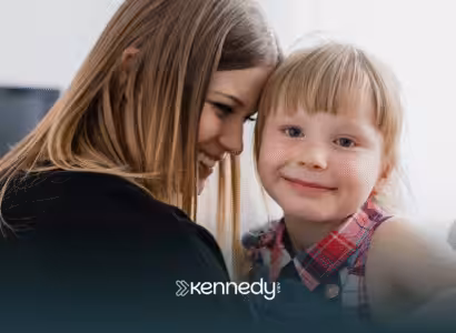 A mom and her daughter smiling together