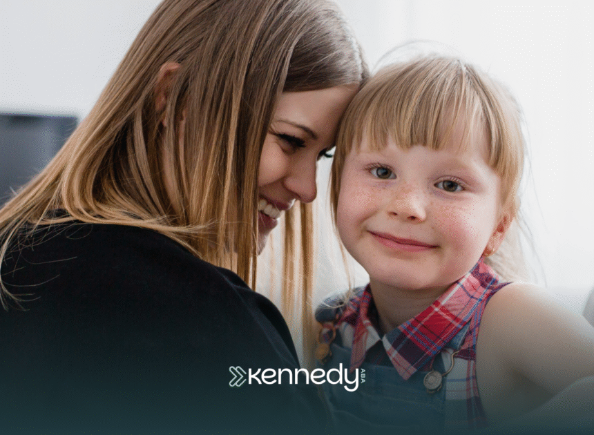 A mom and her daughter smiling together