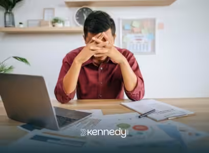 An autistic adult looking stressed at work