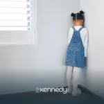 A kid on time out, facing the wall