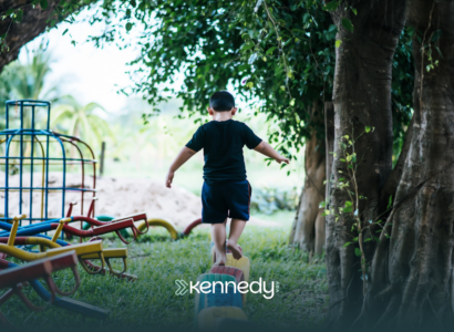 A kid with autism balancing himself on colorful tires, in a recreational spot in Atlanta, Georgia