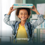 A kid with autism at school, with books on his head