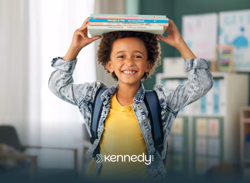 A kid with autism at school, with books on his head
