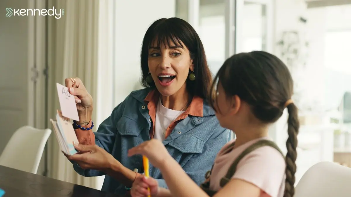 caregiver-showing-flashcards-to-child-during-learning-activity