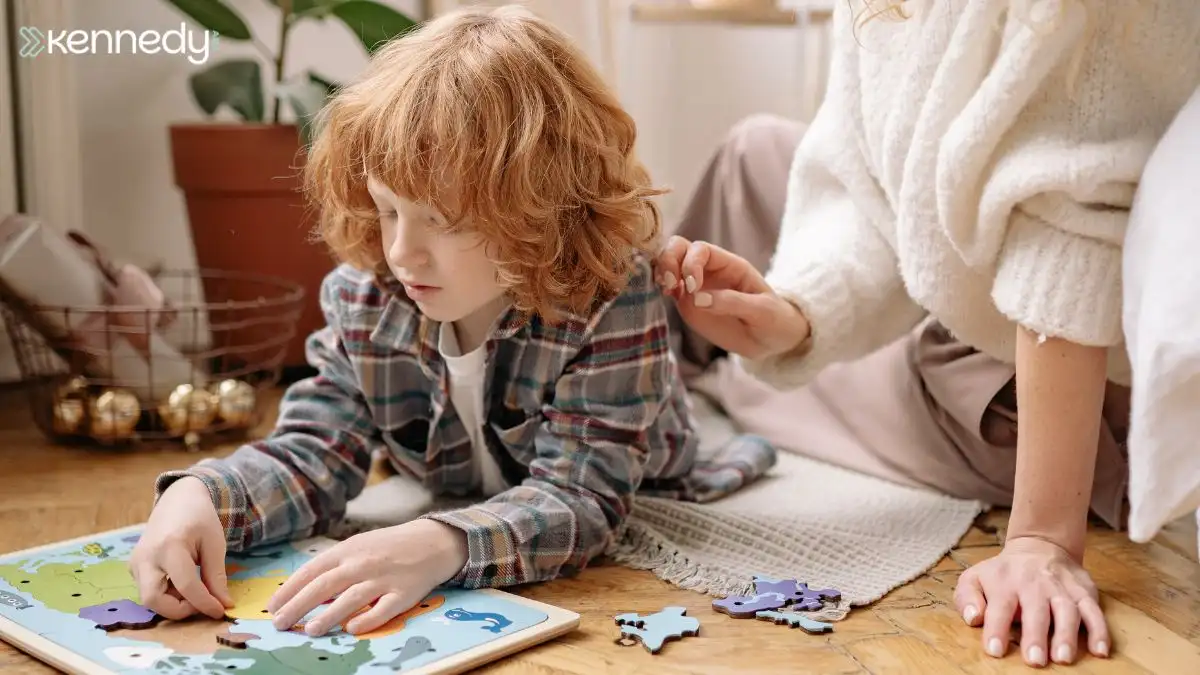 child-completing-wooden-puzzle-on-floor-with-caregiver-support