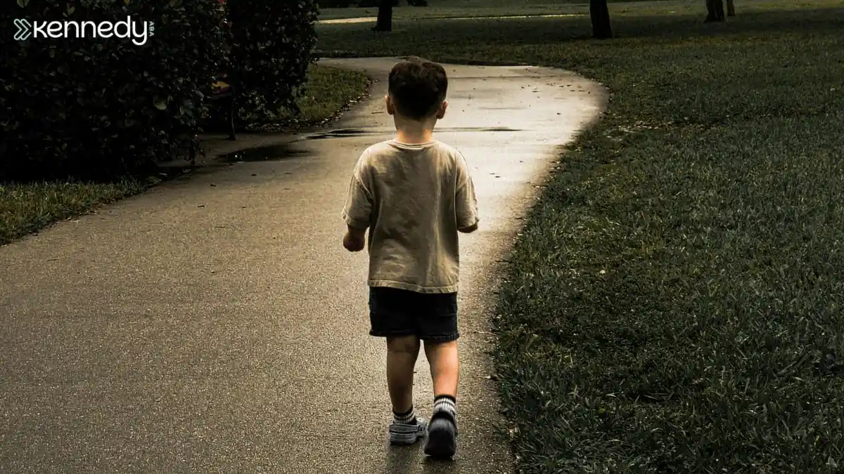 child-wandering-ahead-on-empty-sidewalk-in-outdoor-area