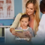 A mom with her daughter speaking to a doctor