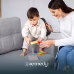 A kid with autism and an ABA therapist during ABA therapy