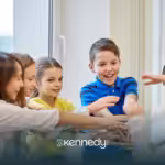A boy with autism wearing blue shirt socializing with other kids